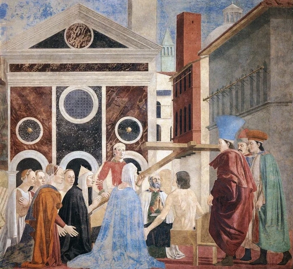 Renaissance fresco by Piero della Francesca showing a crowd gathered around a seated Christ with a large cross, set against an architectural backdrop.